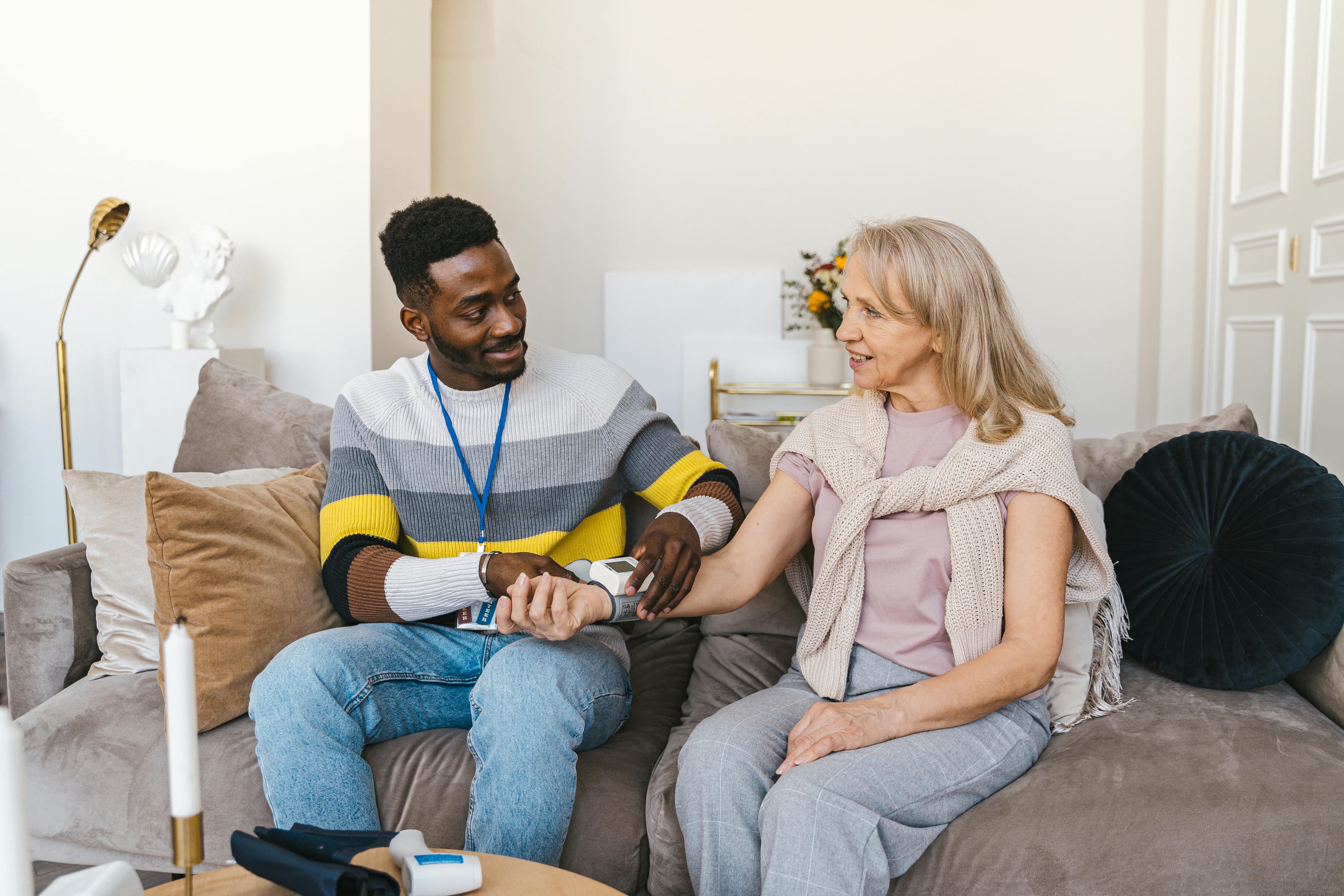Healthcare professional measuring blood pressure - step 1 of tracking process